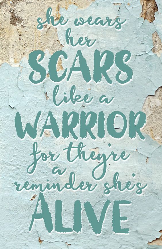 she wears her scars
